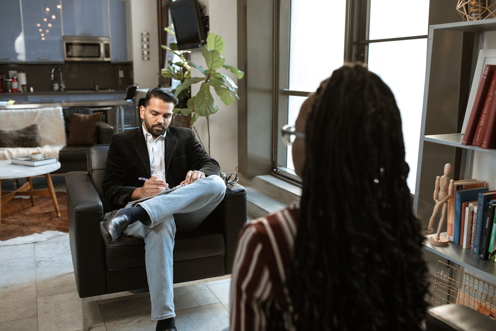 A business professional conducts a consultation with a business owner about asset protection strategies for their business.