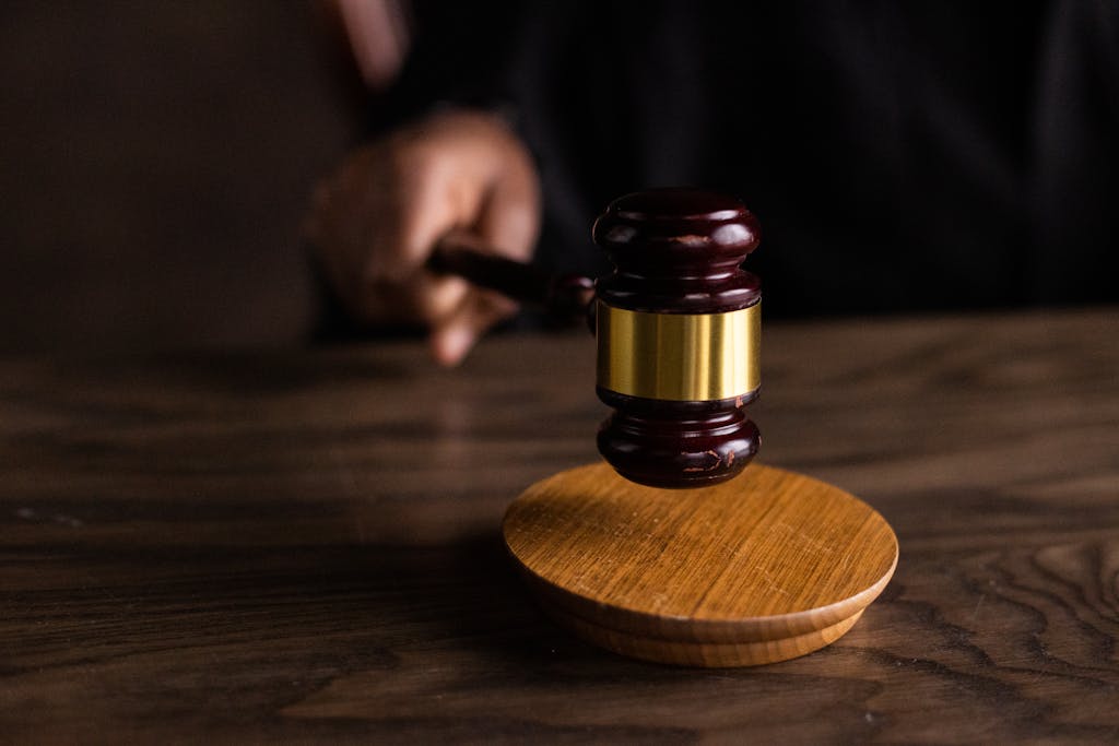 A gavel striking a sound block, symbolizing justice and legal authority in a Tampa avoiding probate courtroom setting.