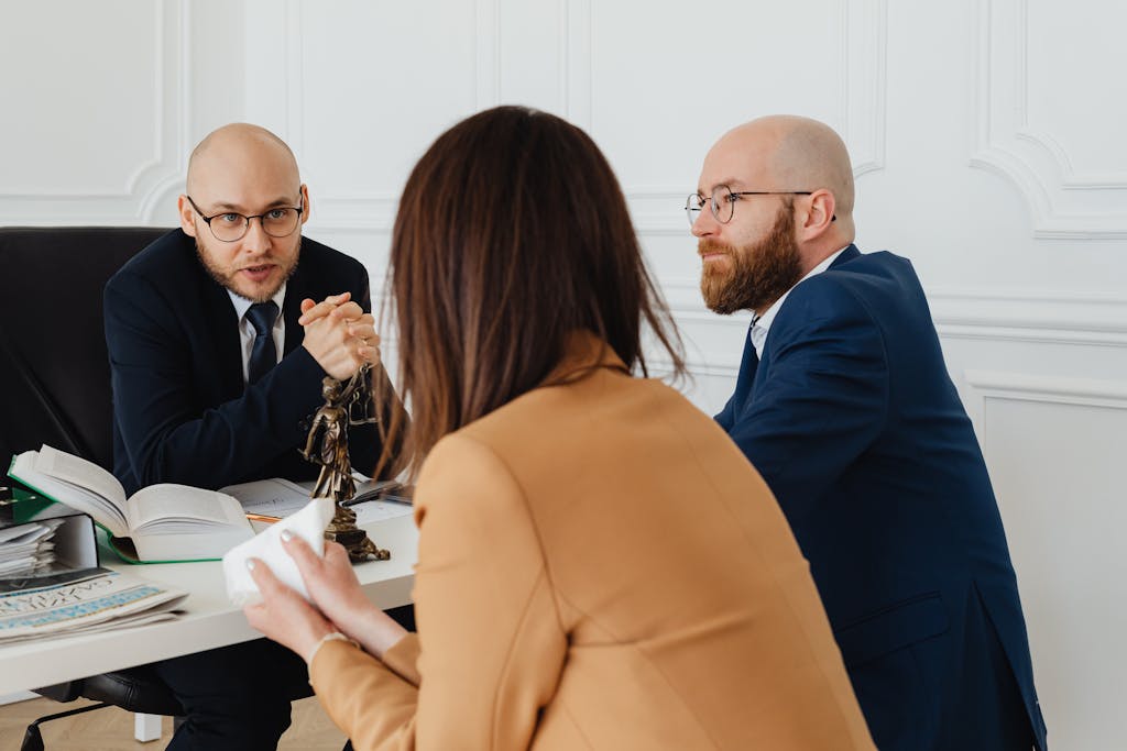 Professional discussion among lawyers in a modern office, focusing on a commercial litigation matter.